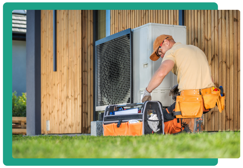 Image of a contractor working on a leased heat pump.
